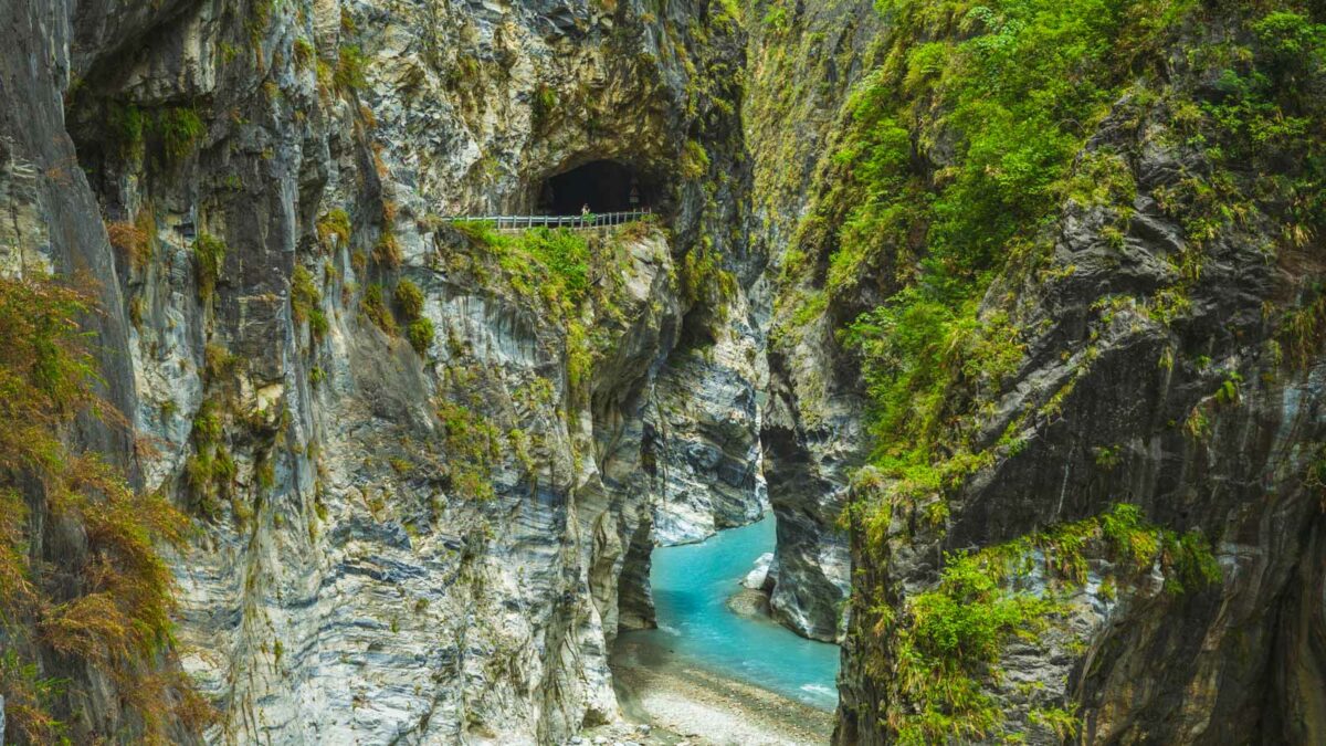 Waterfall And Stream Going Through Mountain Range In Taiwan